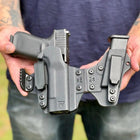 Rounded Gear Sidecar Holster - Black Held In Hand