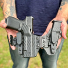 Rounded Gear Sidecar Holster - Carbon Fiber Held In Hand